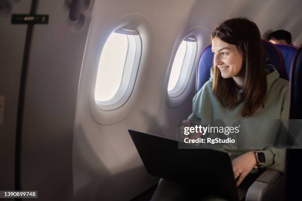 girl traveling by a plane and shopping online - comfortable flight stock pictures, royalty-free photos & images