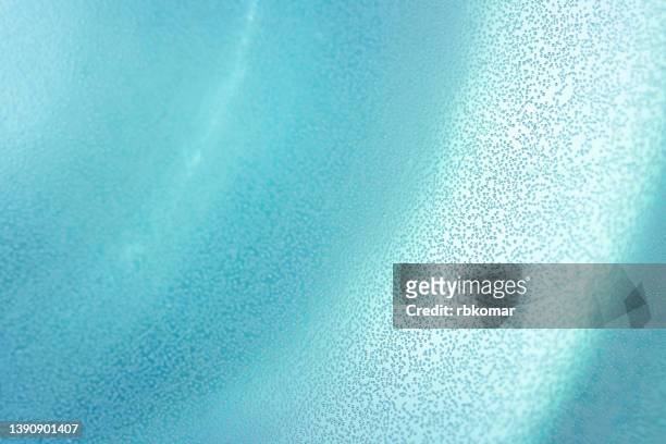turquoise background of transparent clean sparkling water with soda. swirl natural gradient blue pattern - fizzy drink stockfoto's en -beelden