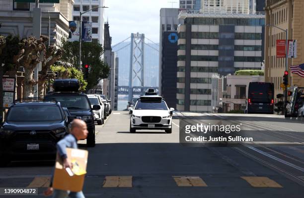 Waymo autonomous vehicle drives along California Street on April 11, 2022 in San Francisco, California. San Francisco is serving as testing grounds...