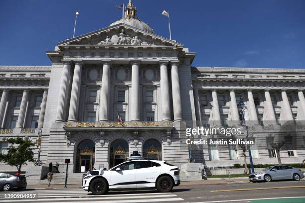 Waymo autonomous vehicle drives by San Francisco City Hall on April 11, 2022 in San Francisco, California. San Francisco is serving as testing...