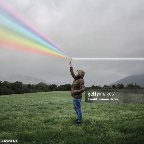 magnifying glass rainbow - veränderung stock-fotos und bilder