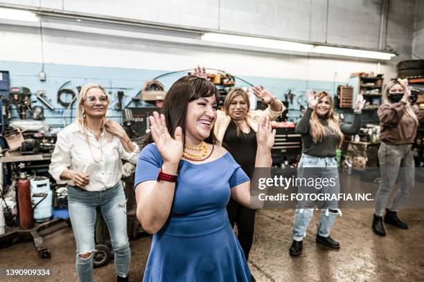 latin women dancing at the fiesta birthday party - line dancing stock pictures, royalty-free photos & images