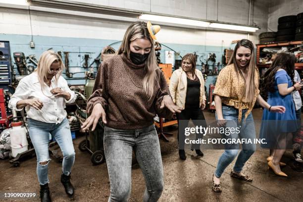 latin women dancing at the fiesta birthday party - line dancing stock pictures, royalty-free photos & images