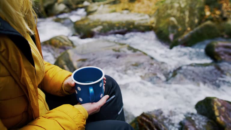 https://media.gettyimages.com/id/1390920713/video/woman-relaxing-and-holding-tea-cup-beside-flowing-water.jpg?b=1&s=640x640&k=20&c=ouQHYuXAsCpy5_jOjpkwnjIrQwc2Bc8laXzRppBSO20=