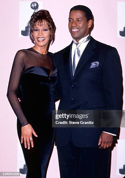 Whitney Houston and Denzel Washington pose at the NAACP Image Awards on April 6, 1996 in Los Angeles, California.