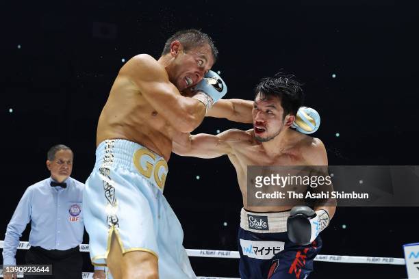 Ryota Murata of Japan and Gennadiy Golovkin of Kazakhstan exchange punches in the 6th round during the IBF & WBA Middleweight title bout at Saitama...