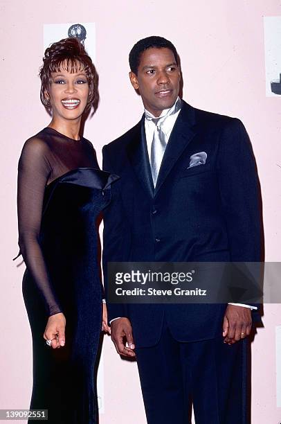 Whitney Houston and Denzel Washington pose at the NAACP Image Awards on April 6, 1996 in Los Angeles, California.