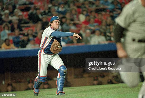 Catcher Gary Carter of the New York Mets tries to throw out a base runners during a Major League Baseball game between the New York Mets and the San...