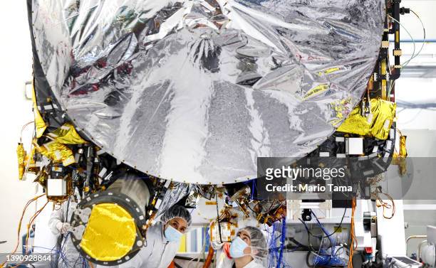 Clean room engineers prepare the Psyche mission spacecraft inside a Spacecraft Assembly Facility clean room at NASA's Jet Propulsion Laboratory on...
