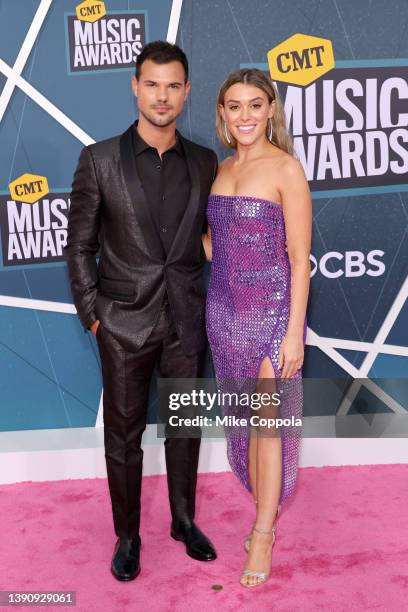 Taylor Lautner and Taylor Dome attend the 2022 CMT Music Awards at Nashville Municipal Auditorium on April 11, 2022 in Nashville, Tennessee.