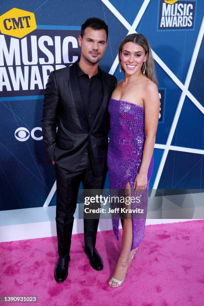 Taylor Lautner and Taylor Dome attend the 2022 CMT Music Awards at Nashville Municipal Auditorium on April 11, 2022 in Nashville, Tennessee.