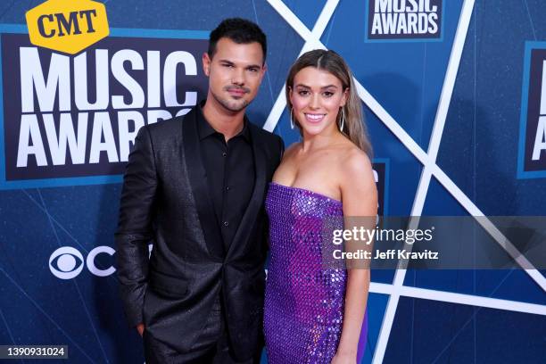 Taylor Lautner and Taylor Dome attend the 2022 CMT Music Awards at Nashville Municipal Auditorium on April 11, 2022 in Nashville, Tennessee.