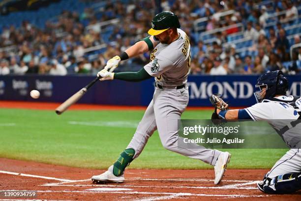 Seth Brown of the Oakland Athletics hits a three run home run against the Tampa Bay Rays in the first inning at Tropicana Field on April 11, 2022 in...