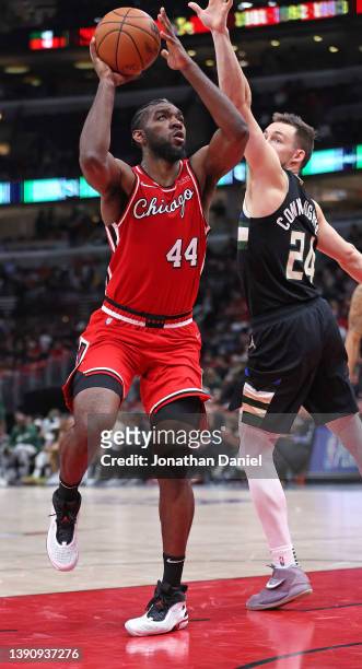 Patrick Williams of the Chicago Bulls shoots against Pat Connaughton of the Milwaukee Bucks at the United Center on April 05, 2022 in Chicago,...