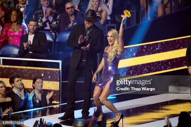 Jason Aldean and Carrie Underwood accept the Collaborative Video award onstage for “If I Didn't Love You” at the 2022 CMT Music Awards at Nashville...