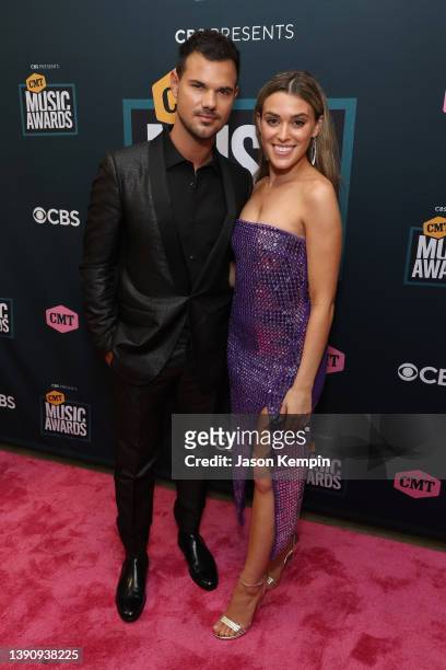 Taylor Lautner and Taylor Dome attend the 2022 CMT Music Awards at Nashville Municipal Auditorium on April 11, 2022 in Nashville, Tennessee.
