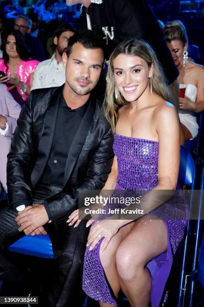 Taylor Lautner and Taylor Dome attend the 2022 CMT Music Awards at Nashville Municipal Auditorium on April 11, 2022 in Nashville, Tennessee.