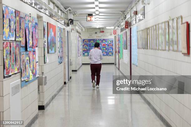 Principal Alice Hom walks a hallway at Yung Wing School P.S. 124 on on April 11, 2022 in New York City. According to the DOE, COVID cases have more...