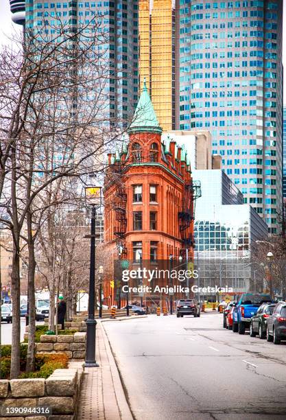 toronto, canada - april 8, 2022: the red-brick gooderham building is a historic landmark of toronto. - day toronto stockfoto's en -beelden