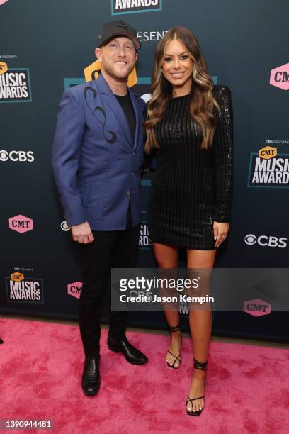 Cole Swindell and Courtney Little attend the 2022 CMT Music Awards at Nashville Municipal Auditorium on April 11, 2022 in Nashville, Tennessee.