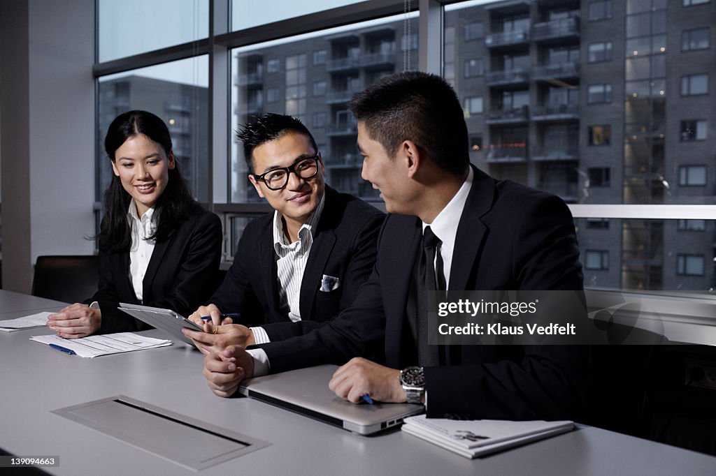 Group of asian businesspeople using tablet