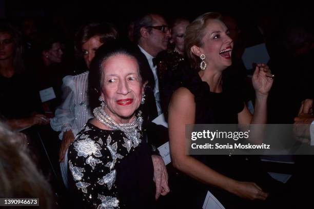 View of French-born American fashion editor Diana Vreeland and Venezuelan fashion designer Carolina Herrera as they attend a Valentino fashion show...