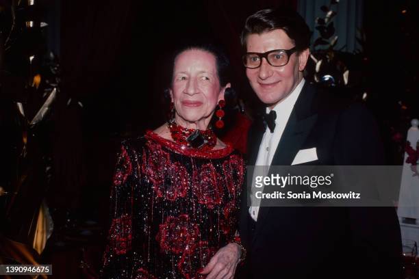French-born American fashion editor Diana Vreeland and French fashion designer Yves Saint Laurent pose together as they attend the Costume Institute...