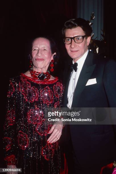French-born American fashion editor Diana Vreeland and French fashion designer Yves Saint Laurent pose together as they attend the Costume Institute...