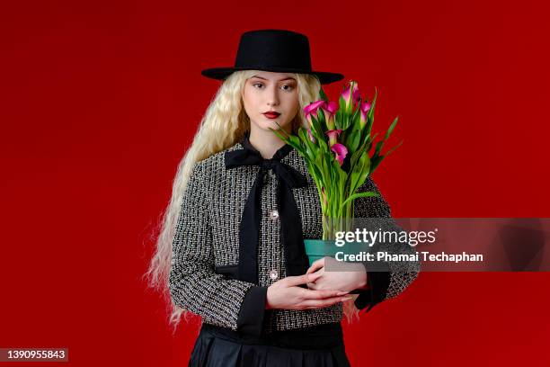 fashionable woman holding flower pot - calla lily stock pictures, royalty-free photos & images