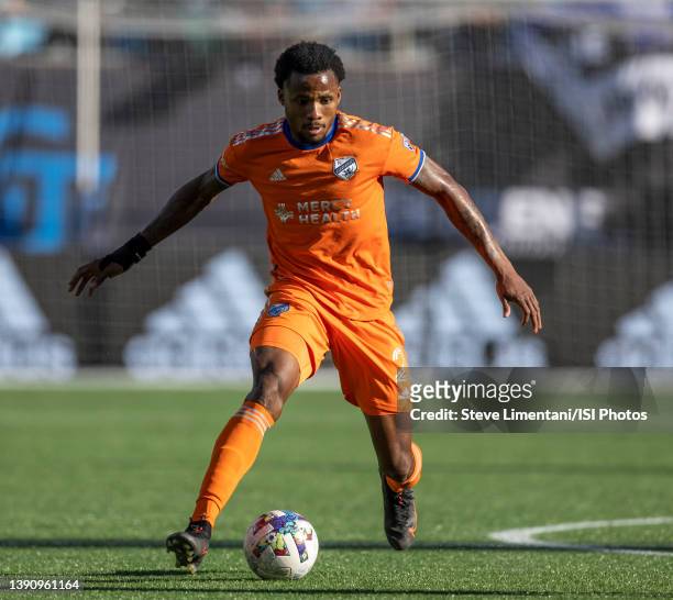 Alvas Powell dribbles with the ball during a game between FC Cincinnati and Charlotte FC at Bank of America Stadium on March 26, 2022 in Charlotte,...