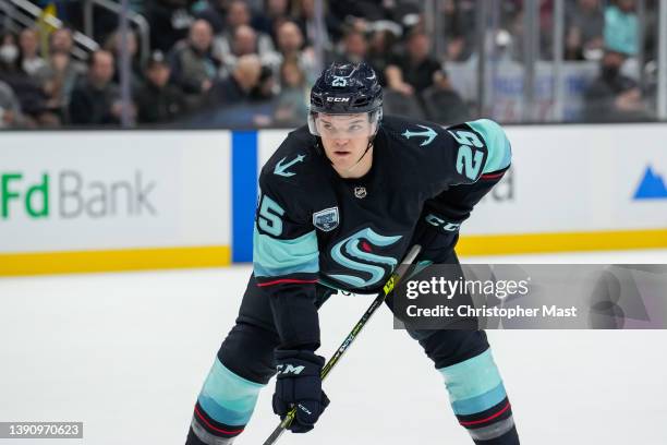 Karson Kuhlman of the Seattle Kraken readies for a face-off against the Calgary Flames during the first period of a game at Climate Pledge Arena on...