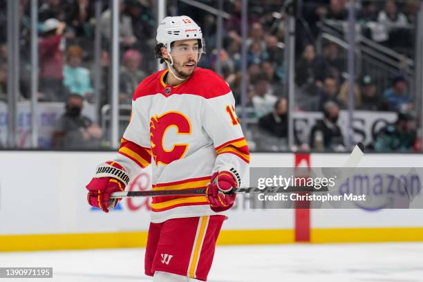 Johnny Gaudreau of the Calgary Flames waits for a face-off against the Seattle Kraken during the third period of a game at Climate Pledge Arena on...