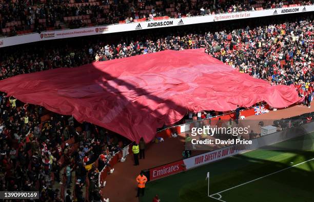 The Arsenal fans hold up a cannon banner before the Premier League match between Arsenal and Brighton & Hove Albion at Emirates Stadium on April 09,...