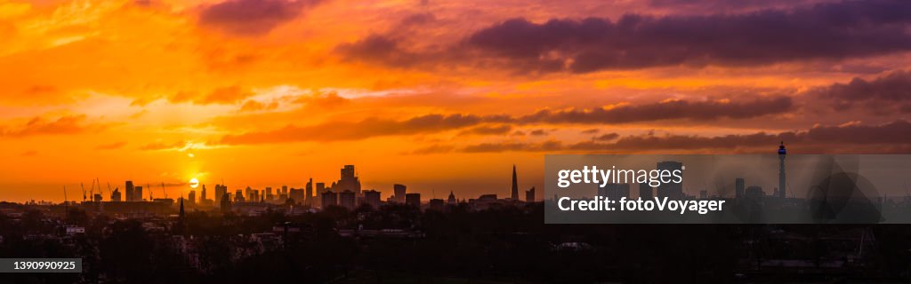 London landmarks cityscape skyline silhouetted against golden sunrise panorama UK