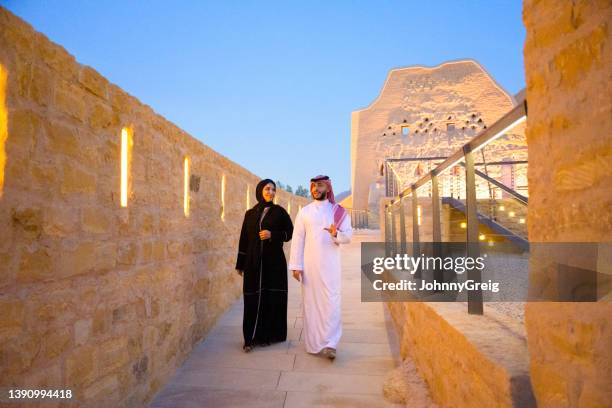 saudi tourists in their 30s visiting at-turaif ruins at dusk - ksa people stock pictures, royalty-free photos & images