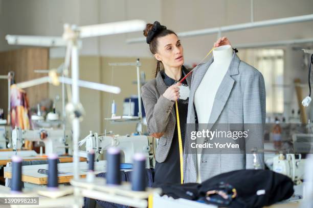 fashion designer working in the studio - textile manufacturing stock pictures, royalty-free photos & images