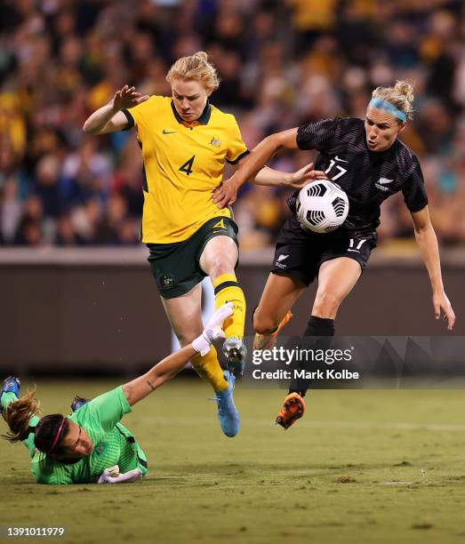 Hannah Wilkinson of New Zealand Ferns competes for the ball with Lydia Williams and Clare Polkinghorne of the Matildas on her way to scoring a goal...