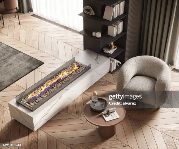 open fire chimney in a cosy apartment - parket stockfoto's en -beelden