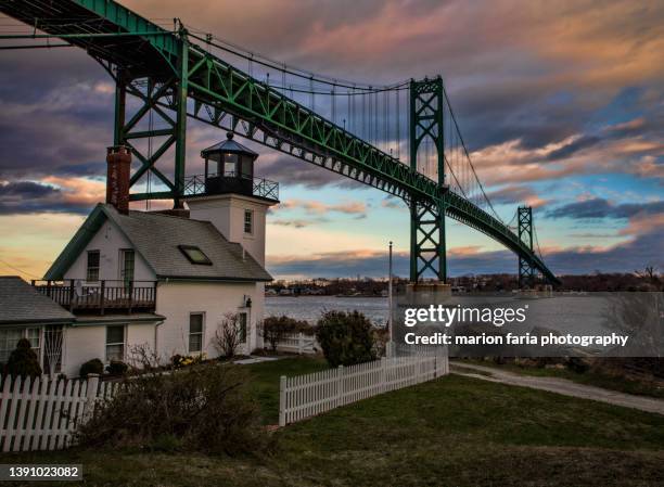 mount hope bridge with lighthouse - rhode island bridge stock pictures, royalty-free photos & images