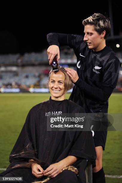 Aivi Luik of the Matildas has her head shaved by Rebekah Stott of New Zealand Ferns after the International womens friendly match between the...