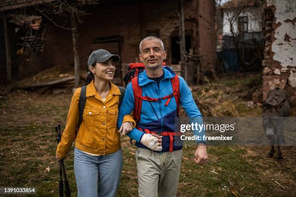 happy couple at the countryside - bags donkey stock pictures, royalty-free photos & images