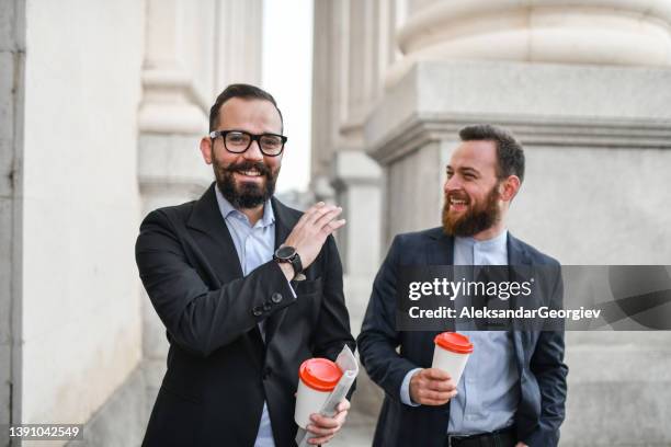 businessmen going to work together with coffee and newspaper in hand - take away coffee cup stock pictures, royalty-free photos & images