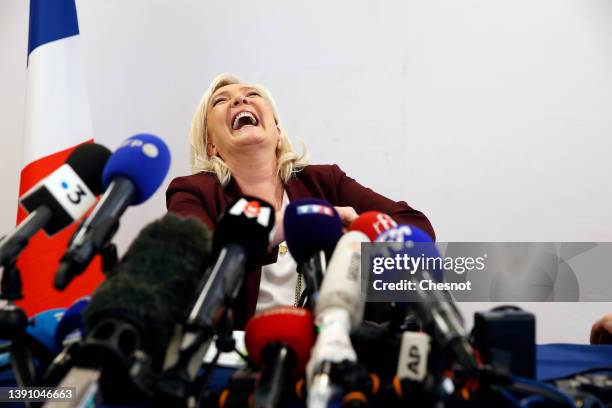 France's far-right party Rassemblement National candidate for the 2022 French presidential election Marine Le Pen speaks to the media during a press...