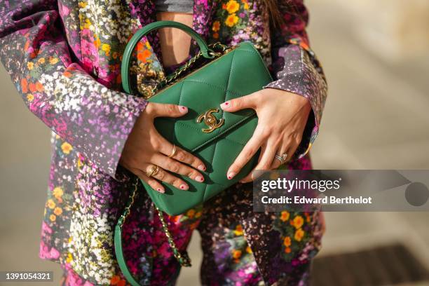 Gabriella Berdugo wears a black with embroidered gold and multicolored flower pattern oversized blazer jacket, matching black with embroidered gold...