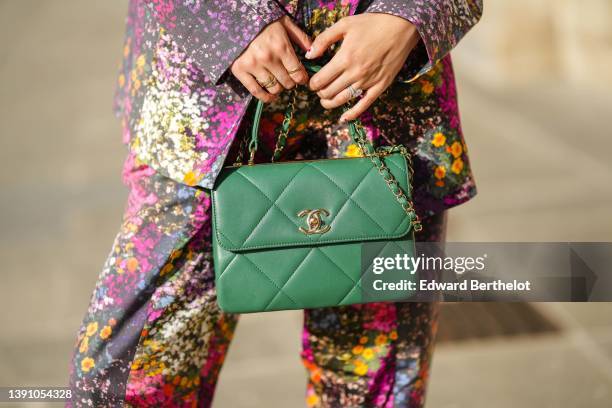 Gabriella Berdugo wears a black with embroidered gold and multicolored flower pattern oversized blazer jacket, matching black with embroidered gold...