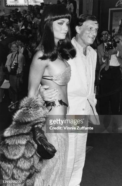Canadian actress and model Carrie Leigh and her partner, American magazine publisher Hugh Hefner attend the Hollywood premiere of 'Beverly Hills Cop...