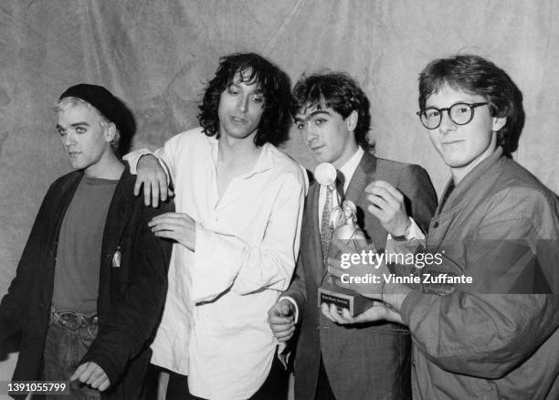 American rock band REM in the press room of the CMJ New Music Awards, held at the Beacon Theatre in New York City, New York, 9th November 1985. The...