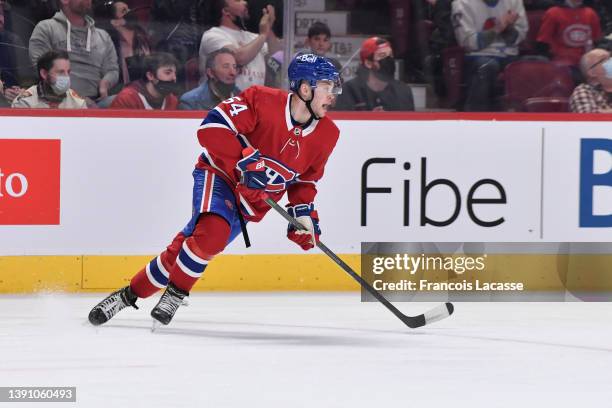 Jordan Harris of the Montreal Canadiens looks to pass the puck against the Ottawa Senators in the NHL game at the Bell Centre on April 5, 2022 in...