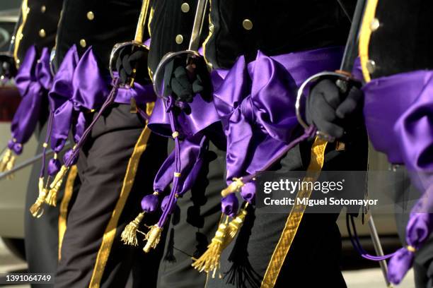 people dressed in purple for holy week - penitente people fotografías e imágenes de stock