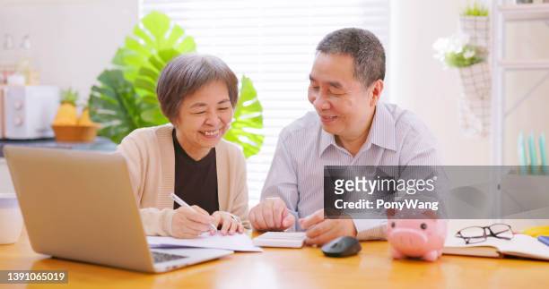 elderly couple retirement plan - married money stock pictures, royalty-free photos & images